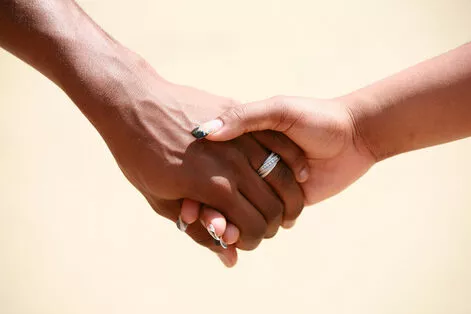 Couple holding hands, needing support for coping mechanisms. Meet with a sex therapist in Plymouth, MN to discuss sexual performance anxiety here. 55447 | 55441 | 55442