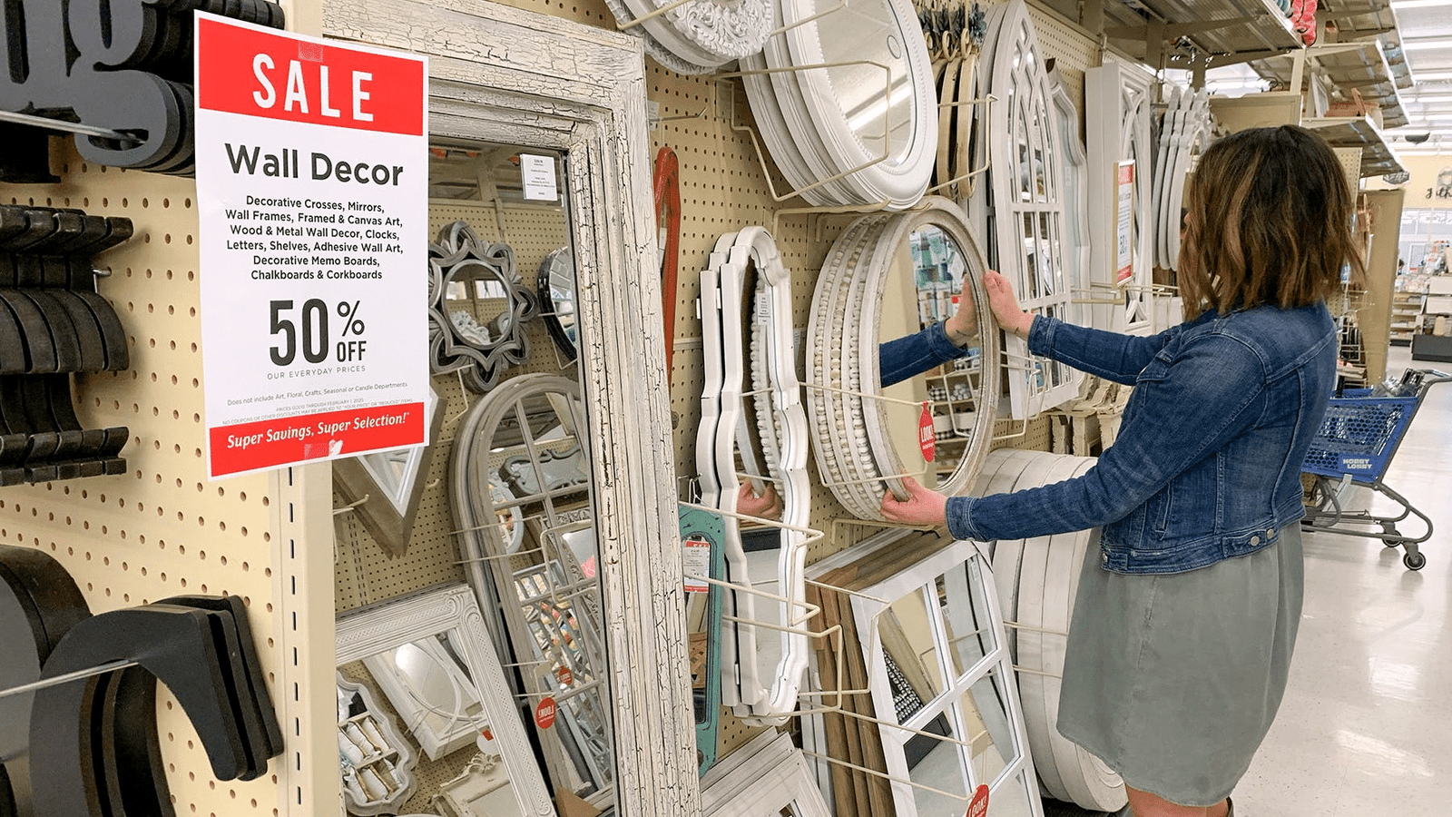 Thrifty Kinkster: Scoring Sales from Stationery Aisles & 9 school discounts, school sales, woman shopping for 50% mirror