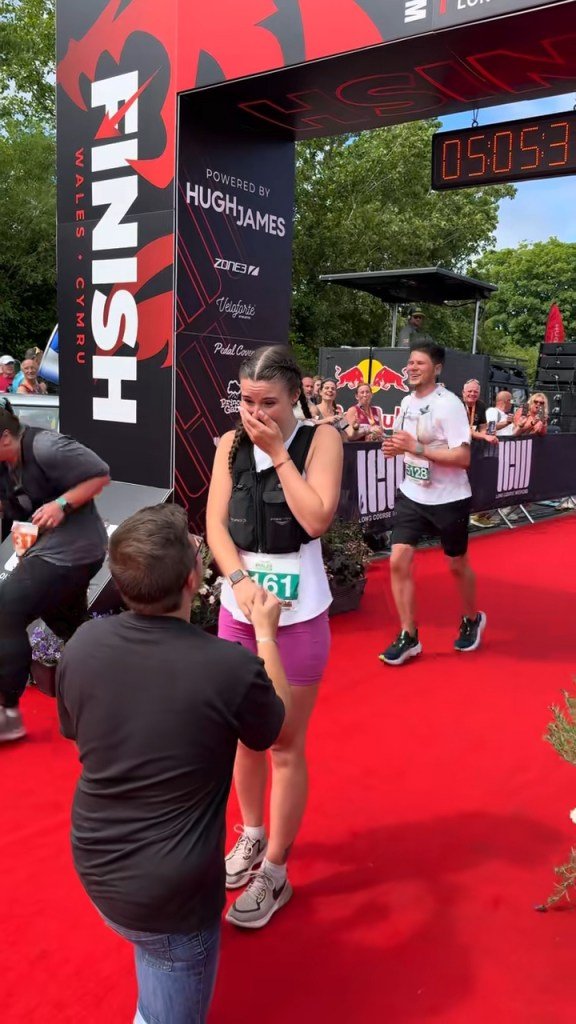 Man proposes to his girlfriend on the finish line of the marathon, woman shows emotions on the red carpet, crowd in the backstage