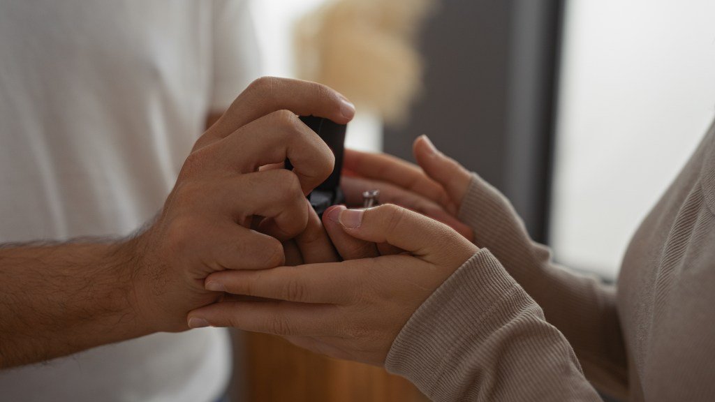 A man proposes to a woman.